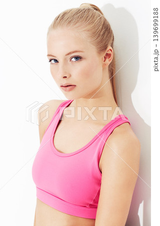 Portrait, fitness and serious young woman in studio isolated on a white background. Face, healthy body and person exercise, blonde model training or sportswear for physical workout in Switzerland Portrait, fitness and serious young woman in studio isolated on a white background. Face, healthy body and person exercise, blonde model training or sportswear for physical workout in Switzerland 139699188