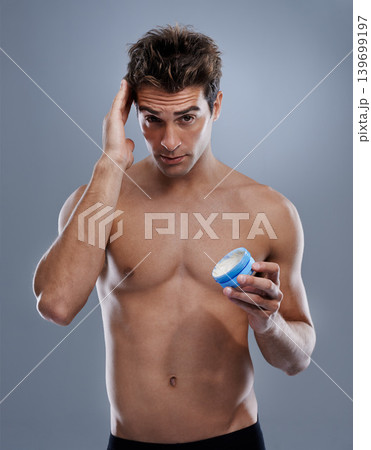 Studio, portrait and man with gel for hair care, cream and shine for styling or salon product. Model, face or happy for conditioner for male beauty or keratin treatment for growth by gray background 139699197