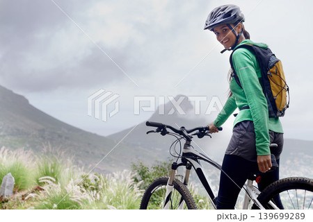 Woman, mountain bike and portrait in nature, adventure and helmet for safety, fitness and mock up space. Girl, bicycle and ready for training, race and outdoor challenge in countryside in Cape Town Woman, mountain bike and portrait in nature, adventure and helmet for safety, fitness and mock up space. Girl, bicycle and ready for training, race and outdoor challenge in countryside in Cape Town 139699289