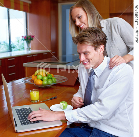 Couple, laptop and home with breakfast, online information and social network scroll with a smile. Marriage, computer and tech with web research, support and love together on the internet in a house 139699436