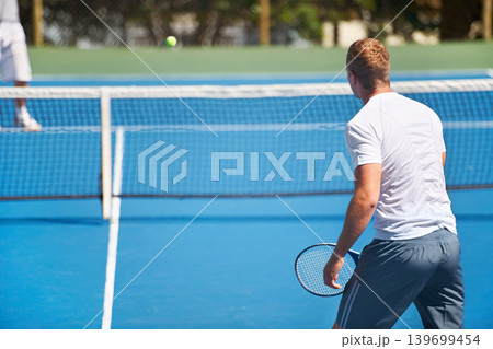 Sport, man and tennis on court with workout, competition and performance outdoor with fitness and energy. Athlete, player and ball on turf for training, exercise and racket with skill, game and hobby 139699454