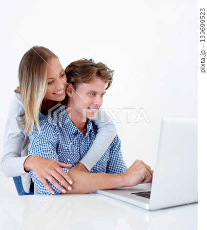 Couple, laptop and hug with email, online information and social network scroll with a smile. Marriage, computer and tech with web research, support and love on the internet with white background Couple, laptop and hug with email, online information and social network scroll with a smile. Marriage, computer and tech with web research, support and love on the internet with white background 139699523