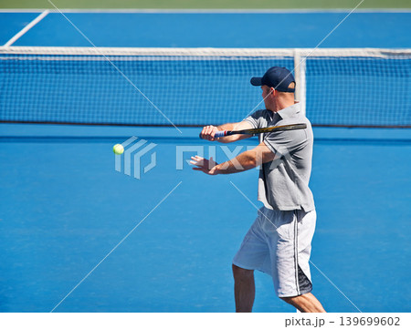 Sport, man and tennis on court with training, competition and performance outdoor with fitness and energy. Athlete, player and ball on turf for serve, exercise and racket with skill, game and hobby 139699602