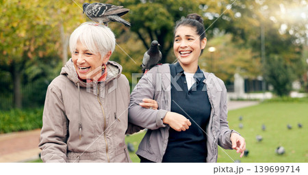 Senior woman, walker and nurse outdoor in a park with healthcare for elderly exercise. Walking, healthcare professional and female person with peace and physical therapy in a public garden with carer Senior woman, walker and nurse outdoor in a park with healthcare for elderly exercise. Walking, healthcare professional and female person with peace and physical therapy in a public garden with carer 139699714
