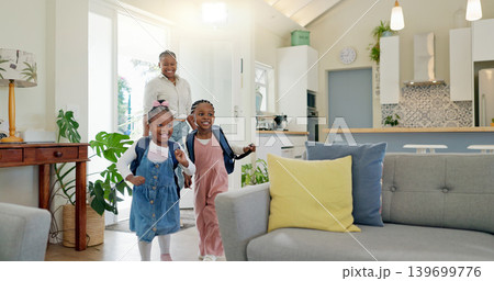 Father, family hug and student after school with love and support in a home feeling happy. House, living room and dad with children and youth with smile and young kids with papa and parent care Father, family hug and student after school with love and support in a home feeling happy. House, living room and dad with children and youth with smile and young kids with papa and parent care 139699776