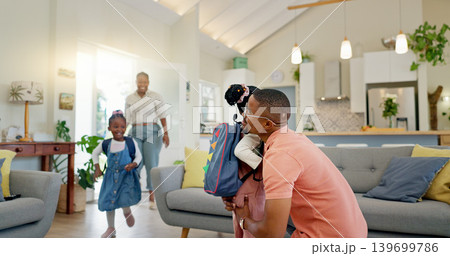 Father, hug and student after school with love and support in a home feeling happy. House, living room and dad with children and youth with a family and young kids together with papa and parent care Father, hug and student after school with love and support in a home feeling happy. House, living room and dad with children and youth with a family and young kids together with papa and parent care 139699786