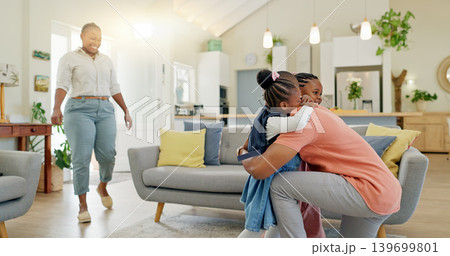 Father, hug and student after school with love and support in a home feeling happy. House, living room and dad with children and youth with a family and young kids together with papa and parent care Father, hug and student after school with love and support in a home feeling happy. House, living room and dad with children and youth with a family and young kids together with papa and parent care 139699801