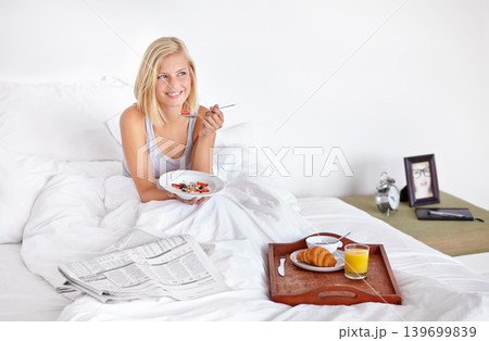 Smile, thinking and food with woman in bed of hotel to wake up for morning hospitality or accommodation. Relax, breakfast and vacation with happy young blonde person in bedroom of home on weekend Smile, thinking and food with woman in bed of hotel to wake up for morning hospitality or accommodation. Relax, breakfast and vacation with happy young blonde person in bedroom of home on weekend 139699839