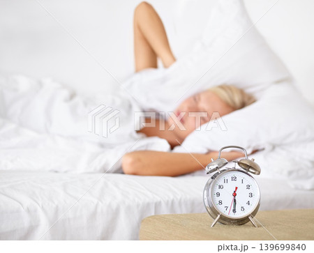 Alarm, clock and woman frustrated to wake up in morning on bed in home with fatigue from rest. Press, snooze and girl angry with time and tired start to day in bedroom and routine in apartment Alarm, clock and woman frustrated to wake up in morning on bed in home with fatigue from rest. Press, snooze and girl angry with time and tired start to day in bedroom and routine in apartment 139699840