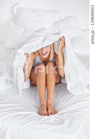 Morning, bed and woman hide with blanket with funny or silly joke in home with sheet to cover body in hotel. Girl, wake up and peek under duvet on head with goofy person in bedroom or apartment Morning, bed and woman hide with blanket with funny or silly joke in home with sheet to cover body in hotel. Girl, wake up and peek under duvet on head with goofy person in bedroom or apartment 139699841