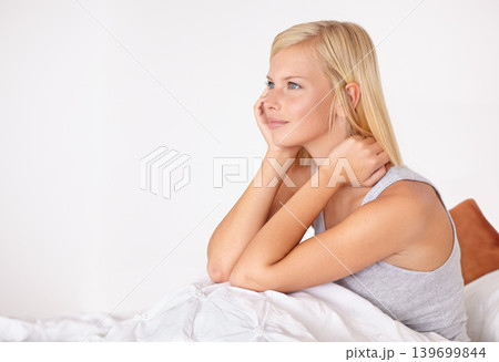 Calm, woman and thinking in home on bed with ideas for morning and wake up with peace. Healthy, person and girl relax in bedroom on holiday, vacation or wellness from rest in apartment mock up 139699844