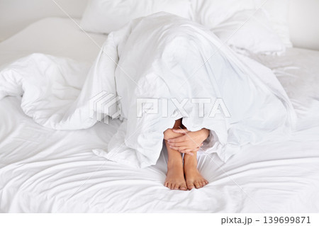 Anxiety, feet and hands in bed with blanket, depression or comfort from fear, panic attack or stress at home. Fail, trauma or person in a bedroom with mental health crisis, scared or hiding in shame Anxiety, feet and hands in bed with blanket, depression or comfort from fear, panic attack or stress at home. Fail, trauma or person in a bedroom with mental health crisis, scared or hiding in shame 139699871