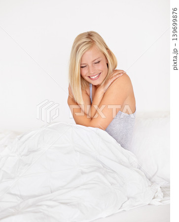 Smile, wake up and cozy in bed with woman in hotel for hospitality or accommodation on vacation. Relax, self love and morning hug with happy young person in bedroom of home, apartment or guest house 139699876