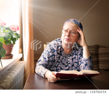 Old woman with big bpook 139700254