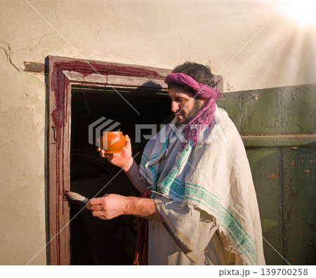Man painting door with blood 139700258