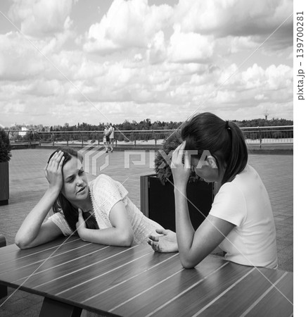 Young girls in a cafe Young girls in a cafe 139700281