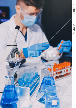 Lab technician experimenting in lab Lab technician experimenting in lab 139700703