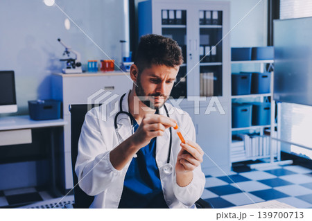 Attractive student of chemistry working in laboratory 139700713