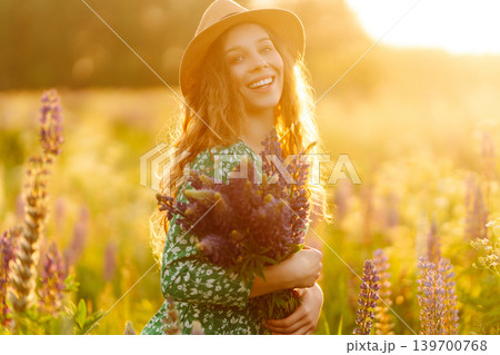 Young woman enjoying nature at sunset while walking. Nature concept. Young woman enjoying nature at sunset while walking. Nature concept. 139700768