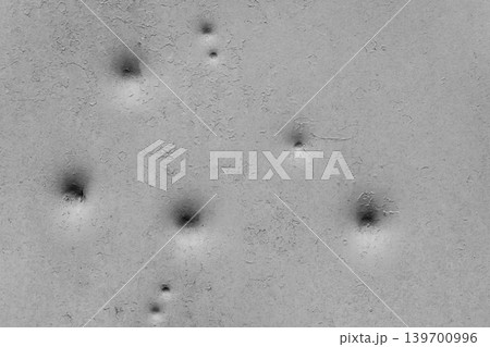 Dents pattern holes bullet shot marks metal surface old background iron texture steel white light paint Dents pattern holes bullet shot marks metal surface old background iron texture steel white light paint 139700996