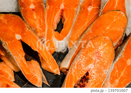 Raw salmon steak fish fresh seafood supermarket counter background sea food freshness Raw salmon steak fish fresh seafood supermarket counter background sea food freshness 139701007