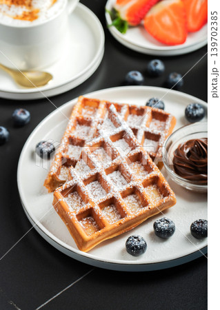 Belgium waffles Homemade waffles with strawberries Belgium waffles Homemade waffles with strawberries 139702385