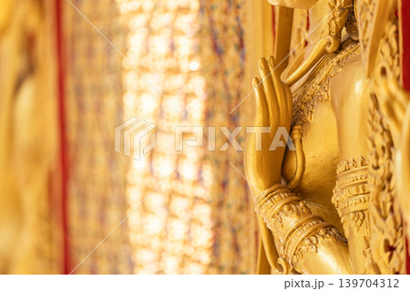 High relief guardian figure temple door Prasat Thong Kham Kanchanaphisek golden palace Wat Chantharam, ThaSung UthaiThani Thailand gilded ornament mirrored mosaic. 139704312