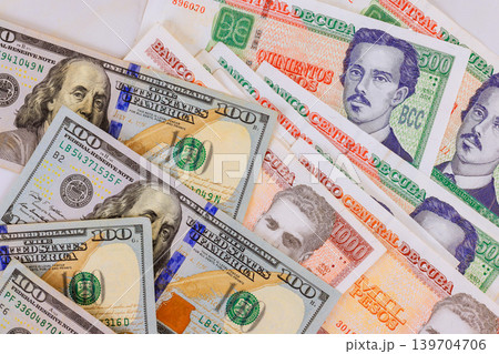 Cuban pesos currency CUC banknotes assorted denomination from Cuba, American hundred dollar bills 139704706