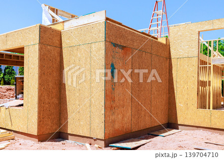 Construction process of house with wooden panels scaffolding 139704710
