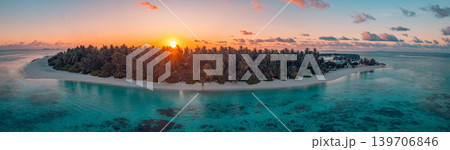 Aerial panoramic Maldives sunset, gorgeous tropical ocean bay with palm tree silhouettes against majestic sky, breathtaking island travel landscape, dreamy scenic aerial view Aerial panoramic Maldives sunset, gorgeous tropical ocean bay with palm tree silhouettes against majestic sky, breathtaking island travel landscape, dreamy scenic aerial view 139706846