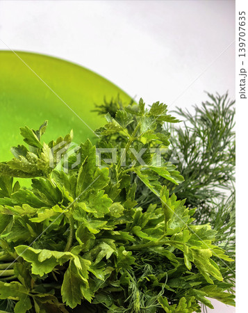 Fresh Green Herbs Arranged On Plate Surface 139707635