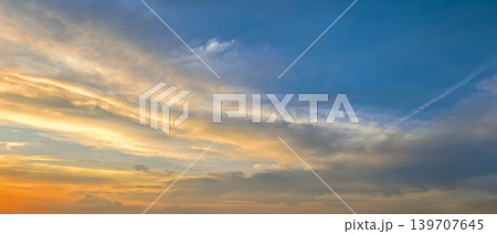 Blue And Golden Sunset Sky With Clouds Blue And Golden Sunset Sky With Clouds 139707645