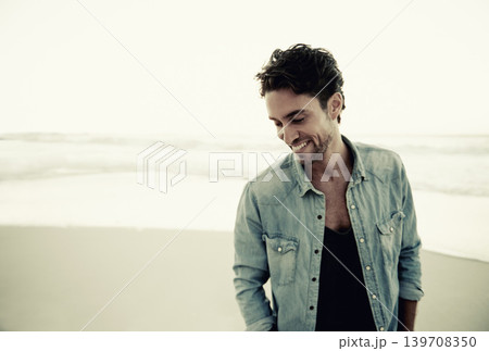 Man, beach and thinking with smile on vacation in trendy clothes, edgy style and remember by waves. Person, ocean or sea with ideas, happy and memory on holiday, outdoor and island with mockup space 139708350
