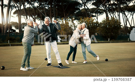 Bowls, high five and celebration with senior friends outdoor, cheering together during a game. Motivation, support or applause and a group of elderly people cheering while having fun with a hobby 139708387