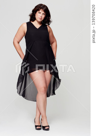 Fashion portrait, dress and studio woman with glamour outfit, trendy style or elegant apparel. Classy, formal evening wear and female model confident in silk clothes isolated on white background Fashion portrait, dress and studio woman with glamour outfit, trendy style or elegant apparel. Classy, formal evening wear and female model confident in silk clothes isolated on white background 139708420