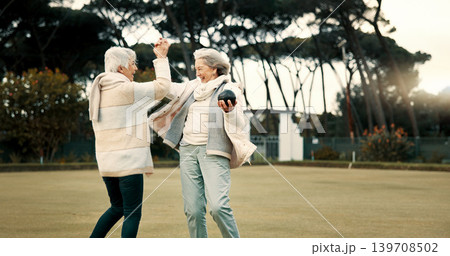 Senior women, high five and park for sport, lawn bowling and happy for fitness, goal and celebration in nature. Teamwork, elderly lady friends and metal ball for games, contest and winning together Senior women, high five and park for sport, lawn bowling and happy for fitness, goal and celebration in nature. Teamwork, elderly lady friends and metal ball for games, contest and winning together 139708502