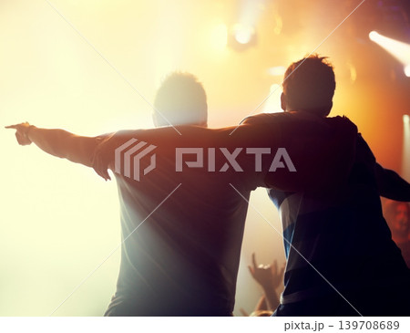 Night, concert and friends dance to music at festival, event of party on holiday and vacation. Rock, fans and people embrace in celebration at club disco, rave and audience with light from stage Night, concert and friends dance to music at festival, event of party on holiday and vacation. Rock, fans and people embrace in celebration at club disco, rave and audience with light from stage 139708689