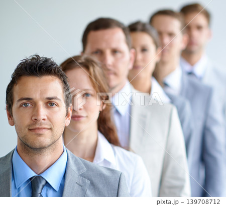 Man, portrait and serious for interview, finance career and ready for selection process. Worker, corporate accountant in suit or professional in workplace, colleagues in background and confident Man, portrait and serious for interview, finance career and ready for selection process. Worker, corporate accountant in suit or professional in workplace, colleagues in background and confident 139708712