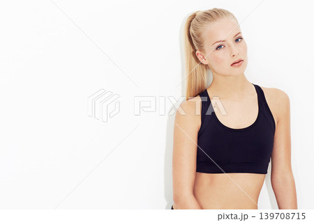 Portrait, fitness and beauty of serious woman in studio isolated on a white background mockup space. Face, young person exercise and blonde model training in sportswear for workout in Switzerland Portrait, fitness and beauty of serious woman in studio isolated on a white background mockup space. Face, young person exercise and blonde model training in sportswear for workout in Switzerland 139708715