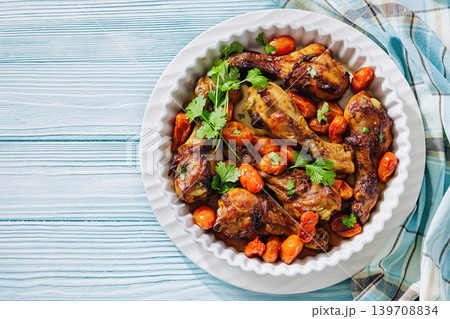 Roasted chicken drumsticks with tomatoes in a dish Roasted chicken drumsticks with tomatoes in a dish 139708834
