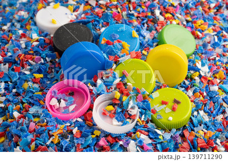 Bangkok, Thailand April 20, 2024 Plastic recycle pellets and caps for industrial use. Bangkok, Thailand April 20, 2024 Plastic recycle pellets and caps for industrial use. 139711290