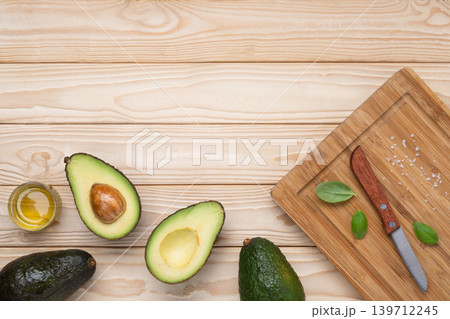 Healthy avocado cooking ingredients wooden background Healthy avocado cooking ingredients wooden background 139712245
