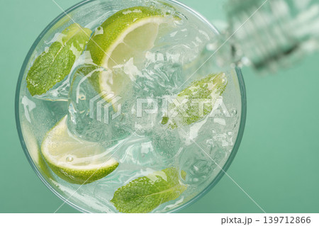 Fresh mojito cocktail sparkling water pouring 139712866