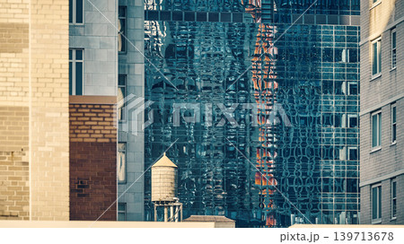 Water tower on a roof in downtown New York, color toning applied, USA. 139713678