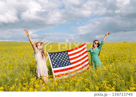 4th of July. Independence Day. Patriotic holiday. USA flag fluttering in the wind. 139713749