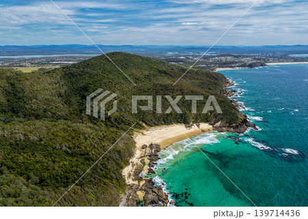 Aerial view of the rocky coastline at McBrides Beach in Forster 139714436