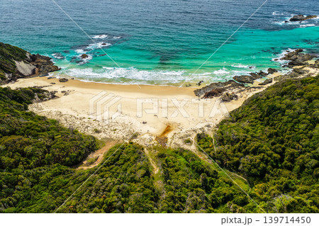 Aerial drone view over McBrides Beach showing the surrounding coastal landscape Aerial drone view over McBrides Beach showing the surrounding coastal landscape 139714450