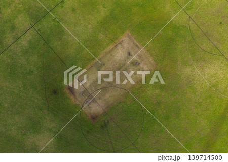 Aerial drone view directly above sports playing field at Maitland Park Sportsground in Maitland, New South Wales, Australia showing painted field markings on green grass surface. Aerial drone view directly above sports playing field at Maitland Park Sportsground in Maitland, New South Wales, Australia showing painted field markings on green grass surface. 139714500