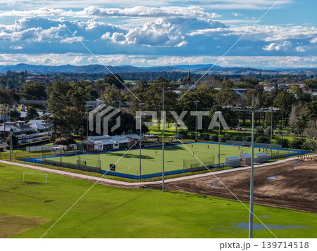 Aerial drone view of sports complex in Maitland Park, Maitland, New South Wales, Australia showing multiple playing fields and recreational facilities. 139714518