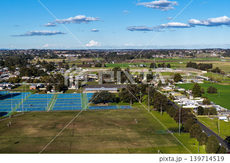Aerial drone view of sports complex in Maitland Park, Maitland, New South Wales, Australia showing multiple playing fields and recreational facilities. 139714519